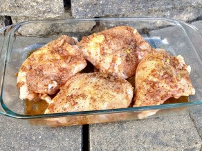 Chicken breasts coated with glaze and ready for baking.